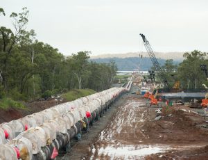 Pipestring exiting mainland cofferdam